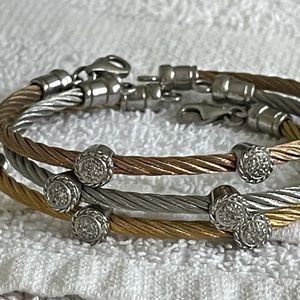 Three stainless steel and diamond station bracelets